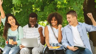 students celebrating college acceptance letters